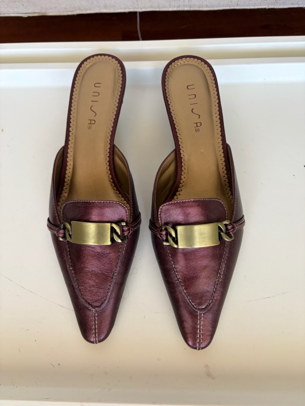 Unisa Metallic Burgundy Pointed Slip-On Mules with Gold Buckle